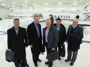 Jeff Polovick (second from left) and Danny Hooper (centre) on the road  with the senior management team of Driving Force.
