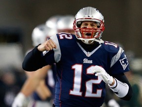 Tom Brady #12 of the New England Patriots reacts after a play in the third quarter against the Baltimore Ravens during the 2015 AFC Divisional Playoffs game at Gillette Stadium on January 10, 2015 in Foxboro, Massachusetts. (Jim Rogash/Getty Images/AFP)