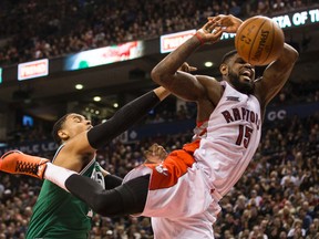 Celtics’ Jared Sullinger brings down the hammer on the Raptors’ Amir Johnson during the first half at the ACC last night. (Craig Robertson/Toronto Sun)