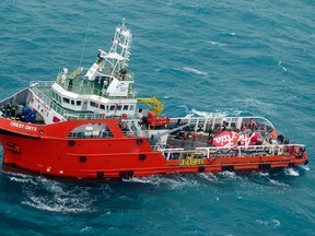 The tail of AirAsia QZ8501 passenger plane is seen on the deck of a the Indonesian Search and Rescue (BASARNAS) ship Crest Onyx after it was lifted from the sea bed, south of Pangkalan Bun, Central Kalimantan January 10, 2015. Indonesian search and rescue teams raised on Saturday the tail of an AirAsia passenger jet that crashed nearly two weeks ago with the loss of all 162 people on board, and will soon search it for the flight recorders. Indonesia AirAsia Flight QZ8501 lost contact with air traffic control during bad weather on Dec. 28, less than half way into a two-hour flight from Indonesia to Singapore. There were no survivors.  REUTERS/Suharso/Pool