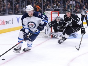 Jan 10, 2015; Los Angeles, CA, USA; Los Angeles Kings defenseman Matt Greene (2) defends Winnipeg Jets center Bryan Little (18) in the first period of the game at Staples Center. Mandatory Credit: Jayne Kamin-Oncea-USA TODAY Sports