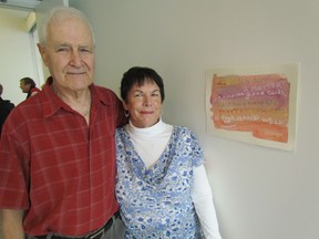 Don and Anne Craig stand next to his watercolour on display over the weekend at the Judith and Norman Alix Art Gallery in downtown Sarnia, as part of a show of work from an art program run with the Alzheimer Society of Sarnia Lambton. The display ran Saturday and Sunday. PAUL MORDEN/THE OBSERVER/ QMI AGENCY