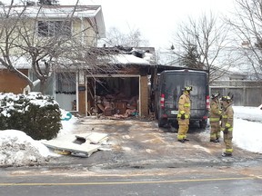 Fire broke out in a garage at 65 Tiverton Dr. Sunday, Jan. 11, 2015 with heavy black smoke pouring from the building. No one was hurt, and firefighters were able to contain the flames. Damage is estimated at $20,000.
AEDAN HELMER/OTTAWA SUN
