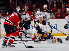Cody McCormick #8 of the Buffalo Sabres goes to a knee to block a shot by Marek Zidlicky #2 of the New Jersey Devils during the third period at the Prudential Center on January 6, 2015 in Newark, New Jersey. The Devils defeated the Sabres 4-1.  Bruce Bennett/Getty Images/AFP