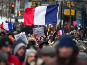 Thousands of Montrealers march to the French Consulate, in tribute to the victims of the shootings by gunmen at the offices of the satirical weekly newspaper Charlie Hebdo in Paris, in downtown Montreal, January 11, 2015. French citizens will be joined by dozens of foreign leaders, among them Arab and Muslim representatives, in a march on Sunday in an unprecedented tribute to this week's victims, including journalists and policemen, following the shootings by gunmen at the offices of the satirical weekly newspaper Charlie Hebdo, the killing of a police woman in Montrouge, and the hostage taking at a kosher supermarket at the Porte de Vincennes. REUTERS/Christinne Muschi