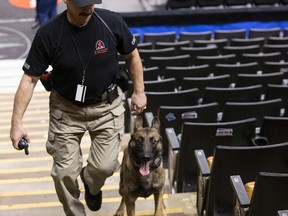 Dave Walker works his Command Response Dogs before a Toronto Raptors game at the Air Canada Centre. (CRAIG ROBERTSON, Toronto Sun)
