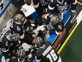 Edmonton Rush defensive coach Jimmy Quinlan (with marker board) speaks with his players during a time out against the Minnesota Swarm at Rexall Place in Edmonton on Saturday, Jan. 10, 2015. The Swarm scored 9 in the 4th to win 14-10. Ian Kucerak/Edmonton Sun/ QMI Agency