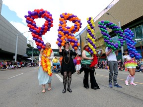 Marchers holds balloons spelling PRIDE during the Pride Parade in downtown Edmonton, Alta., on Saturday, June 7, 2014.  Perry Mah/Edmonton Sun/QMI Agency