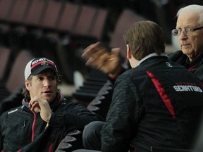 Ottawa Senators GM Bryan Murray chats with fellow execs Randy Lee and Shean Donovan during practice at Canadian Tire Centre in Ottawa Monday, Jan. 5,  2015.  (Tony Caldwell/Ottawa Sun/QMI Agency)