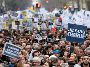 People hold placards which read "I am Charlie" as they take part in a solidarity march (Marche Republicaine) in the streets of Paris. (REUTERS)