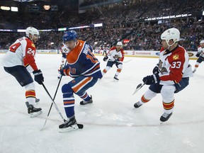 Nail Yakupov  chases a puck during the Edmonton Oilers' 4-3 loss to the Florida Panthers at Rexall Place in Edmonton on Sunday, Jan. 11, 2015. Ian Kucerak/Edmonton Sun/ QMI Agency