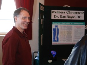 Chiropractor Dr. Dan Boyle provides some health tips to an attendee at the Stirling Wellness Fair. - JASON MILLER/THE INTELLIGENCER