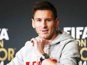 Barcelona's Lionel Messi of Argentin, a nominee for the 2014 FIFA World Player of the Year, attends a news conference prior to the Ballon d'Or awards ceremony in Zurich January 12, 2015. (REUTERS/Ruben Sprich)
