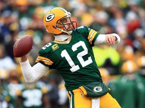 Green Bay Packers quarterback Aaron Rodgers throws a pass against the Dallas Cowboys in the first half in the 2014 NFC Divisional playoff football game at Lambeau Field. (Andrew Weber-USA TODAY Sports)
