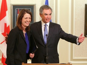 Former Wildrose leader Daniel Smith and Alberta Premier Jim Prentice leave a press conference after they announced that Smith and eight other Wildrose MLA's have quite the party and are joining the Progressive Conservatives, at Government House, in Edmonton Alta., on Wednesday Dec. 17, 2014. David Bloom/Edmonton Sun