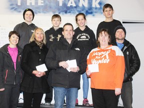 Lift Huron, a local youth weightlifting club that operates out of the Tank CrossFit building on Huckins Street, recently made a number of donations to local organizations. The club donated $400 to Safe Homes for Huron, $350 each to the Huron County branch of Ontario SPCA and the All Points Charitable Fund and $100 to the family of Hunter Costello, a local child receiving treatment for leukemia. Pictured here are club members Jacob Abbott, Damien Preibe, Justine Rivers and Alex Rodriguez (at back), and in front, club coordinator Nicki Darbyson, Vicky Parent from Safe Homes for Huron, Donny Rivers from All Points Charitable Fund, Pat Costello, Hunter’s grandmother and James Laithwaite, owner of the Tank CrossFit. Absent is a representative from the OSPCA. (Dave Flaherty/Goderich Signal Star)