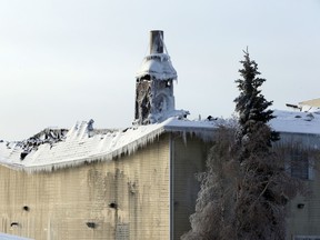 The damage to the roof of Hainstock Funeral Home on 34 ave and 99 st in Edmonton, Alta., on Sunday Jan.11, 2015. A fire started on Jan. 9, 2015 but it reignited on Jan. 10, 2015. Perry Mah/Edmonton Sun
