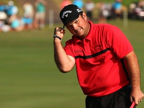 Patrick Reed celebrates his win after finishing a playoff on the 18th hole during the final round of the Hyundai Tournament of Champions at Plantation Course at Kapalua Golf Club in Lahaina, Hawaii on Monday, Jan. 12, 2015. (Mike Ehrmann/Getty Images/AFP)