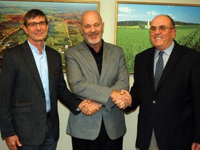 Tomato breeder Steve Loewen, MP Dave Van Kesteren and Ontario Tomato Research Institute chairman Phil Richards were on hand for a federal grant announcement.