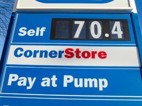 A Husky gas station at Wayne Gretzky Drive and 118 Avenue in Edmonton advertises a regular gas price of 70.4 cents on Monday, Jan. 12, 2015. (Ian Kucerak/Edmonton Sun/ QMI Agency)