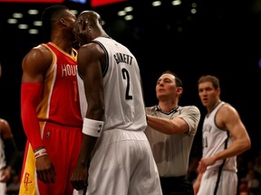 Kevin Garnett #2 of the Brooklyn Nets headbutts Dwight Howard #12 of the Houston Rockets in the first quarter after the two were in a shoving match at the Barclays Center on January 12, 2015 in the Brooklyn borough of New York City. (Elsa/Getty Images/AFP)
