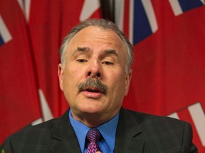 Environmental commissioner Gord Miller holds a press conference at Queens' Park to release his report on government energy efficiency Tuesday, January 13, 2015. (Craig Robertson/Toronto Sun)