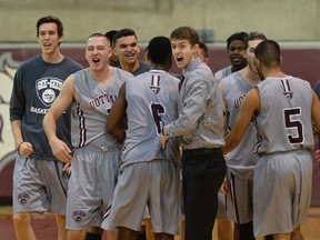 Ottawa Gee-Gees celebrate their win against the Carleton Ravens on Saturday, Jan. 10, 2015. (Matthew Usherwood/Ottawa Sun)