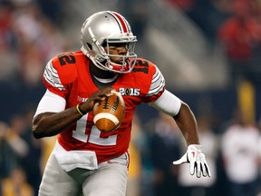 Ohio State Buckeyes QB Cardale Jones drops back to pass against the Oregon Ducks during first quarter action at the College Football National Championship Game at AT&T Stadium in Arlington, Texas, on Monday, Jan. 12, 2015. (Matthew Emmons/USA TODAY Sports)