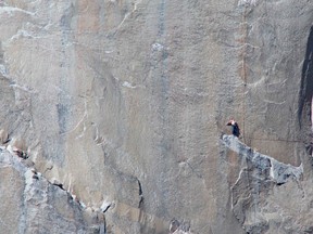 Climber Kevin Jorgeson looks up from Pitch 18 on the Dawn Wall of the El Capitan rock formation in Yosemite National Park, California in this January 12, 2015 handout photo released to Reuters January 13, 2015. One of two climbers trying become the first to scale a 3,000-foot (900-metre) face of the El Capitan rock formation in California's Yosemite National Park without bolts or other climbing tools has cleared a key stretch and believes he will make it to the top, representatives said on Friday.  REUTERS/Tom Evans/Elcapreport.com/Handout via Reuters