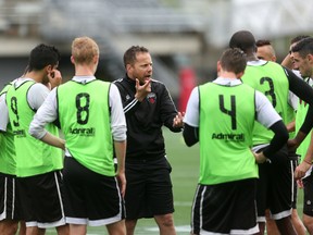 Ottawa Fury FC head coach Marc Dos Santos speaks to his squad during training at TD Place Wednesday. (Chris Hofley/Ottawa Sun)