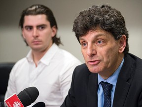 Andrew Creppin, former forward for the University of Ottawa's varsity men's hockey team, and lawyer Lawrence Greenspon. Creppin is making the lawsuit claims on behalf of himself and other members of the 2013-14 hockey team members. They're suing the university for $6M.​ DANI-ELLE DUBE/POSTMEDIA