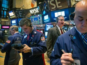 Traders work on the floor of the New York Stock Exchange, Jan. 8, 2015. (BRENDAN McDERMID/Reuters)