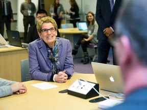 Ontario premier Kathleen Wynne talks with students and professors at Western University in London, Ont., Jan. 13, 2015. (CRAIG GLOVER/QMI Agency)