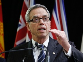 Canada's Finance Minister Joe Oliver speaks to the media in Ottawa, Dec. 15, 2014. (CHRIS WATTIE/Reuters)