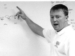 Chris Jones, shown here diagramming a play, is reputed to have waited for eight hours to wrangle an interview for an unpaid support staff job with the football team at Tennessee Tech. (Supplied)