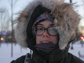 Mackenzie Bromstad's glasses fog up during her cold walk  home from from work, while passing through McBurney Park on Tuesday. (Julia McKay/The Whig-Standard)