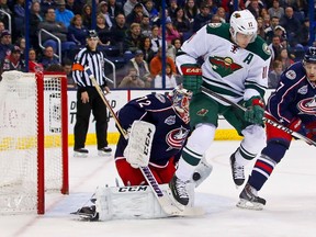 Sergei Bobrovsky of the Columbus Blue Jackets makes a save as Zach Parise of the Minnesota Wild attempts to screen the shot during the first period on December 31, 2014 at Nationwide Arena. (Kirk Irwin/Getty Images/AFP)