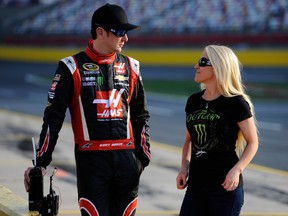 Kurt Busch, driver of the #41 Haas Automation Made in America Chevrolet, stands on the grid with his girlfriend, Patricia Driscoll, during qualifying for the NASCAR Sprint Cup Series Coca-Cola 600 at Charlotte Motor Speedway on May 22, 2014. (Jared C. Tilton/Getty Images/AFP)
