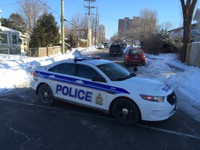 One man was taken into custody after a standoff which lasted about four hours along Alfred St. on Wednesday morning. Cops blocked off several area roads, including Granville and Montfort. (ERROL McGIHON Ottawa Sun)