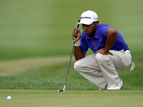 Bhavik Patel lines up his putt on the 18th green during round three of the 2013 Hotel Fitness Championship at Sycamore Hills Golf Club on August 31, 2013 in Fort Wayne, Indiana.  Patrick McDermott/Getty Images/AFP