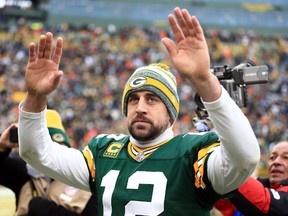 Green Bay Packers quarterback Aaron Rodgers waves to the crowd after the 2014 NFC Divisional playoff football game against the Dallas Cowboys at Lambeau Field on Jan. 11, 2015. (Andrew Weber/USA TODAY Sports)