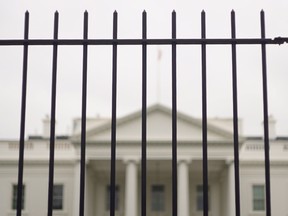 The White House is seen behind a fence on October 3, 2014 in Washington, DC. AFP PHOTO/Mandel NGAN