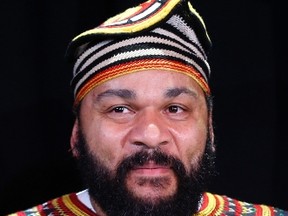 File picture shows French comedian Dieudonne M'Bala M'Bala, also known as just "Dieudonne", as he attends a news conference at the "Theatre de la Main d'or" in Paris January 11, 2014. The French comedian was detained for questioning on Wednesday for writing on his Facebook account he felt "Charlie Coulibaly," a word play combining the widespread "I am Charlie" vigil slogan and the name of one of the three gunmen. Picture taken January 11, 2014.  REUTERS/Gonzalo Fuentes/Files