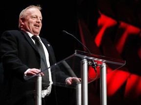 Jeff Hunt, representing the RedBlacks ownership group, speaks after  receiving  the Commissioner's Award from CFL Commissioner Mark Cohon during the CFL Awards Show at the Queen Elizabeth Theatre in Vancouver, B.C., on Thursday, Nov. 27, 2014. (QMI Agency)