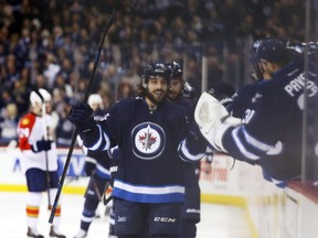 Winnipeg Jets forward Mathieu Perreault (85) celebrates his first of four goals  against the Florida Panthers at MTS Centre Jan. 13, 2015.