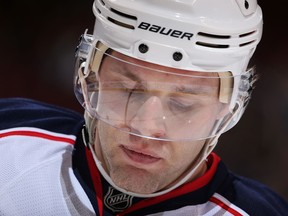 Jack Johnson #7 of the Columbus Blue Jackets skates up to the face off circle during the first period of the NHL game at against the Phoenix Coyotes Jobing.com Arena on January 2, 2014 in Glendale, Arizona.   (Christian Petersen/Getty Images/AFP)