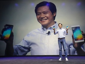 Lei Jun, founder and chief executive officer of China's mobile company Xiaomi, shows Mi Notes at its launch in Beijing Jan. 15, 2015. REUTERS/Jason Lee