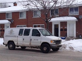 Ottawa Community Housing workers make repairs at a residence on Whitton Place after an early-morning shooting. No one was injured. (COREY LAROCQUE Ottawa Sun)