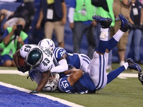 Philadelphia Eagles running back Darren Sproles (43) scores a touchdown as he breaks a tackle by Indianapolis Colts linebacker Josh McNary (57) at Lucas Oil Stadium. (Brian Spurlock-USA TODAY Sports)