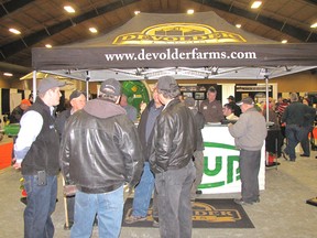 Farmers check out the displays at the 2014 Chatham-Kent Farm Show at the John D. Bradley Convention Centre in Chatham.